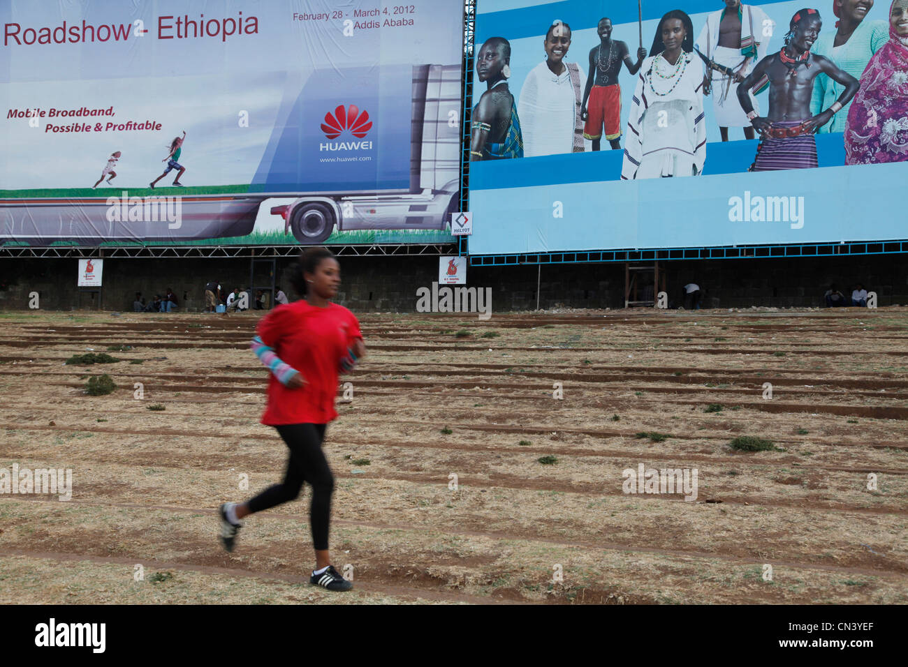 People running and training for marathon in Meskal Square, Addis Ababa
