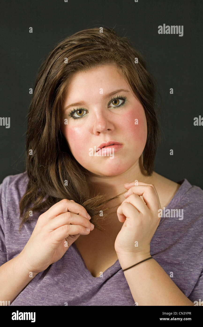 Teenage girl wearing makeup and smiling Stock Photo Alamy