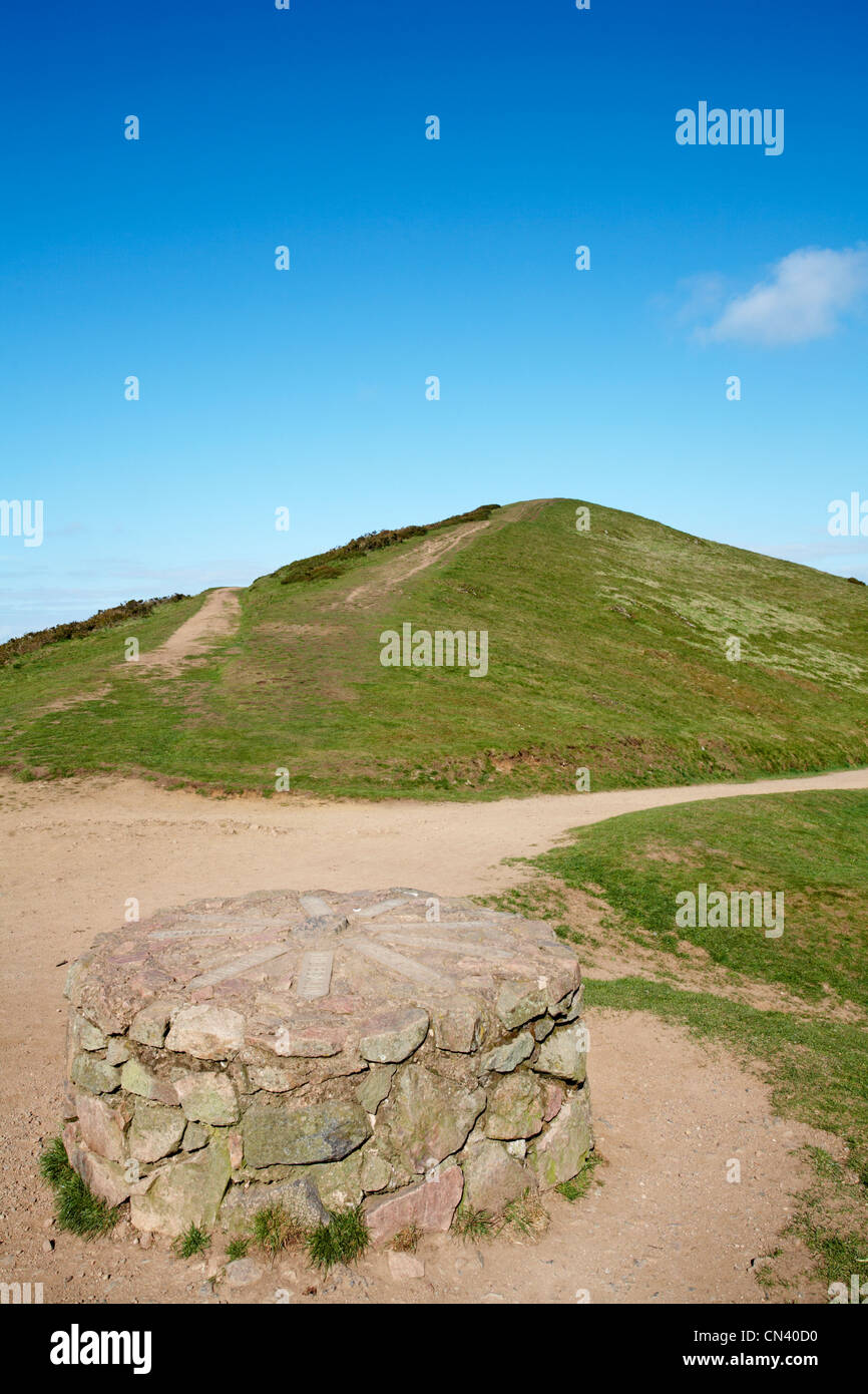 Sugar Loaf in the Malvern hills and indicator stone with place names and directions in April Stock Photo