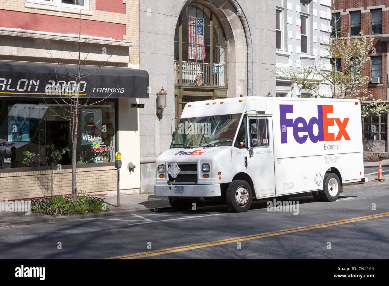 A FedEx express truck makes a local delivery in Tarrytown, New York. Stock Photo