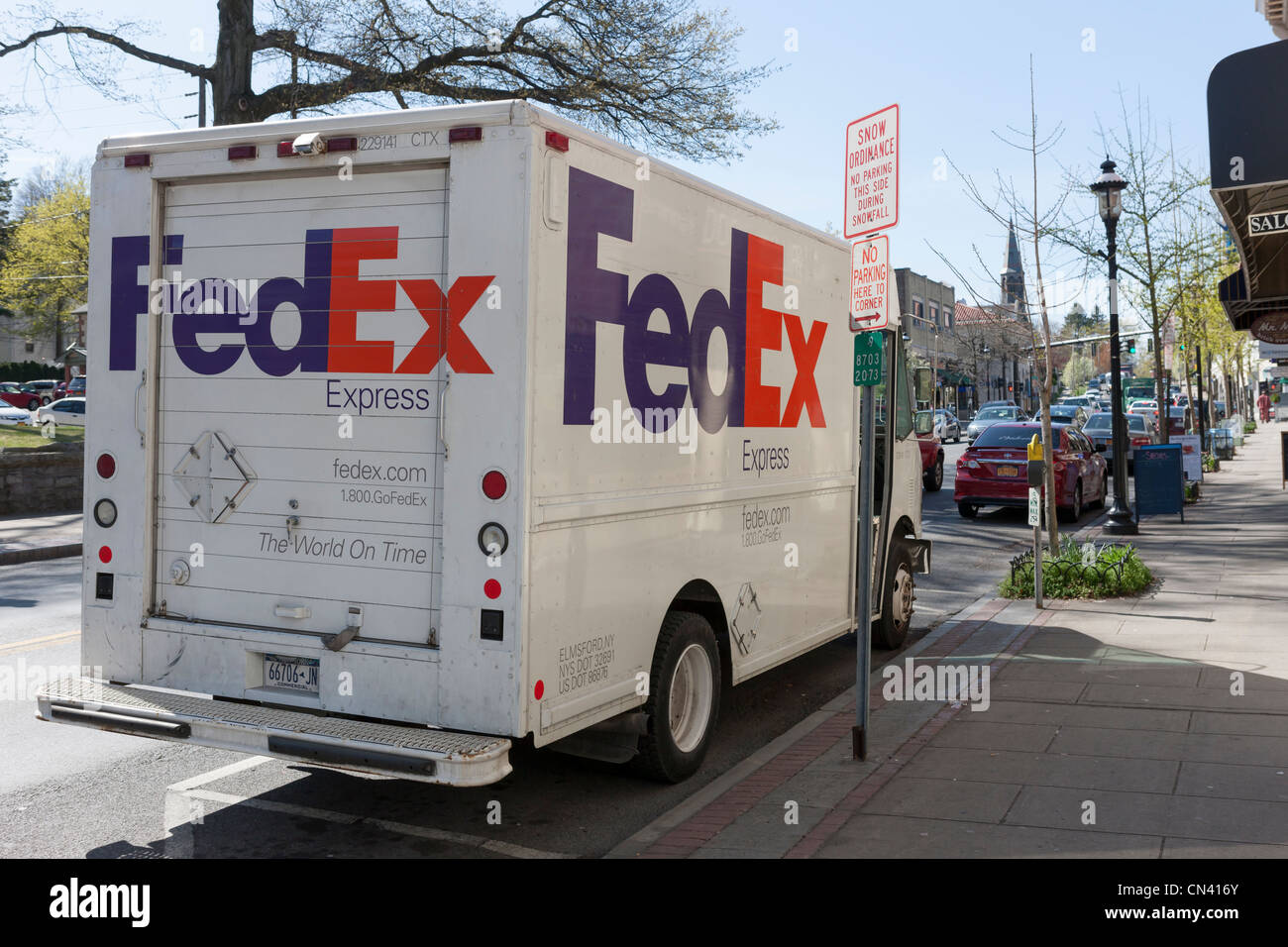 A FedEx Express truck makes a local delivery in Tarrytown, New York. Stock Photo