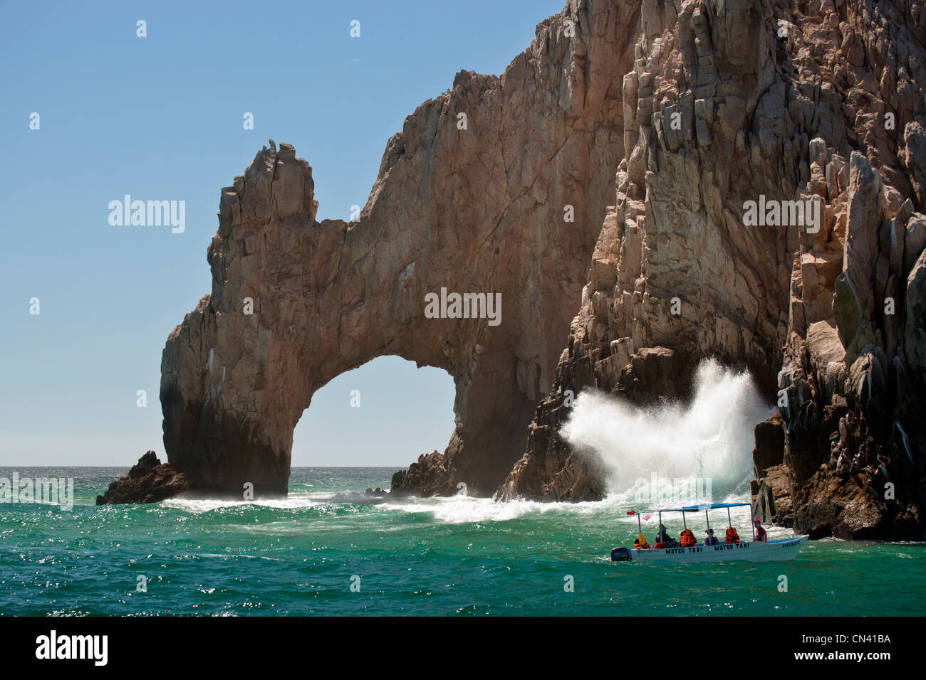 Los Arcos arch and tourboats along Coastline of Cabo San Lucas in Sea of Cortez- Cabo San Lucas-Mexico. Stock Photo