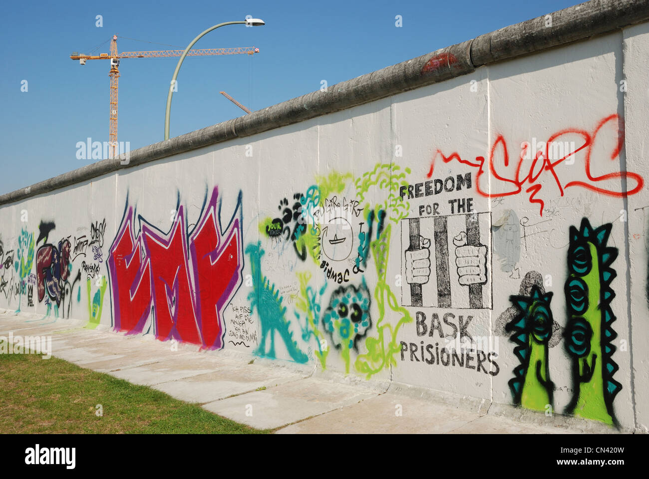 Graffiti on the western side of the Berlin Wall at the East Side Gallery,  Berlin, Germany Stock Photo - Alamy
