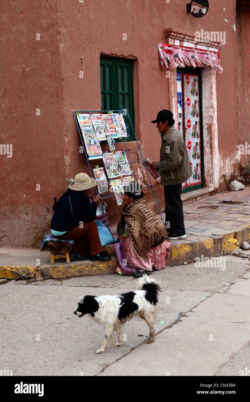 Newspaper stall on street corner outside colonial house , Lampa , Puno department , Peru Stock Photo