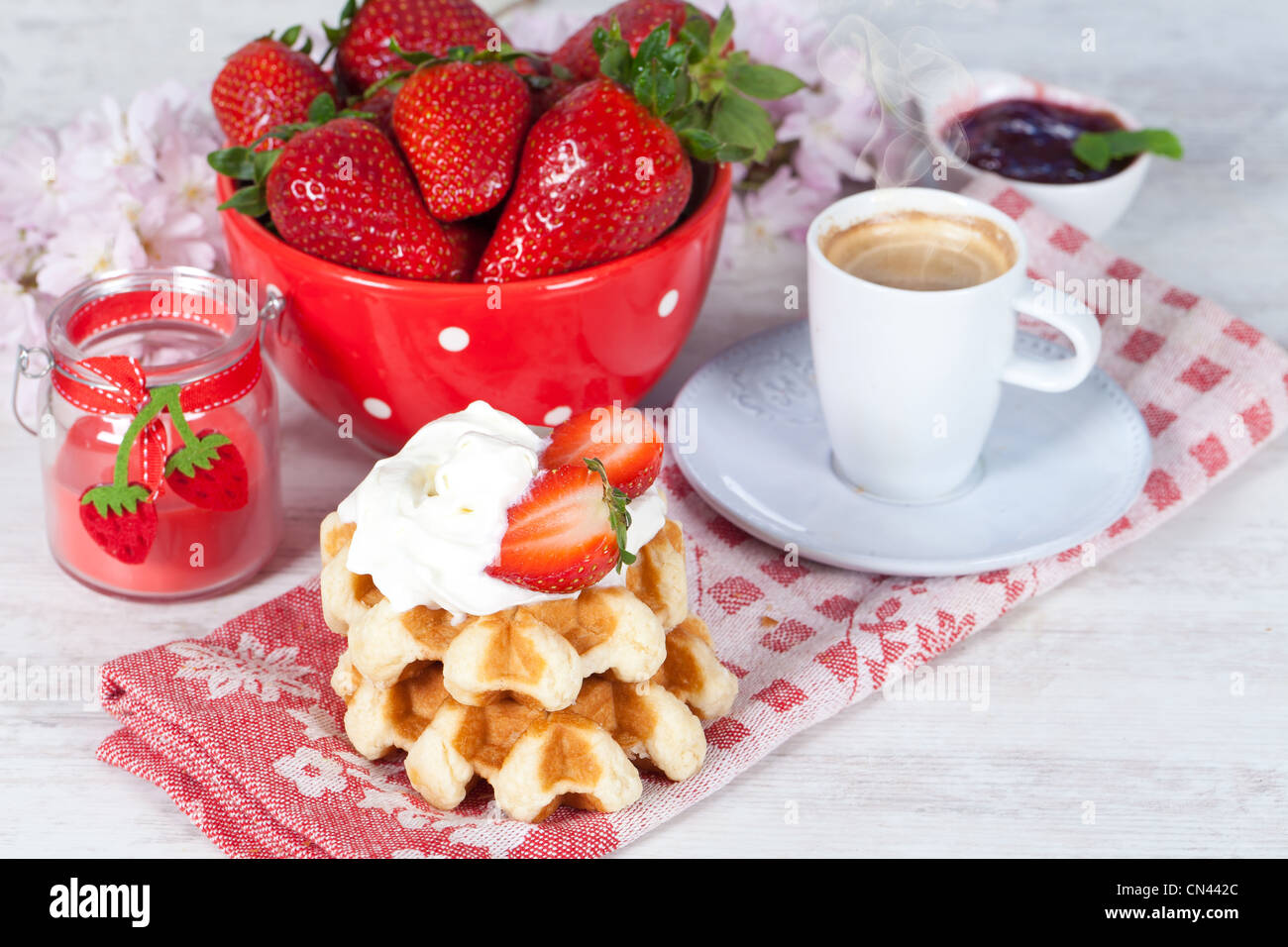 Delicious waffle with whipped cream and strawberries Stock Photo - Alamy