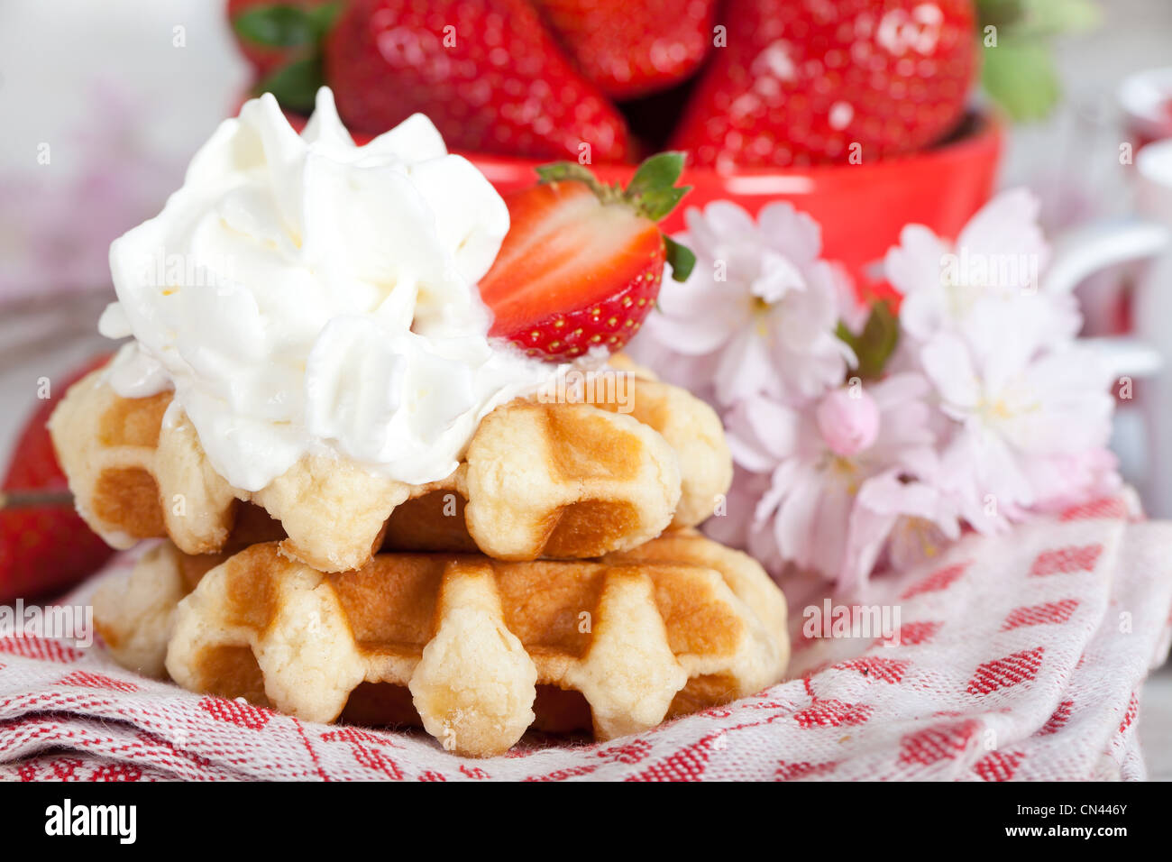 Delicious waffle with whipped cream and strawberries Stock Photo Alamy