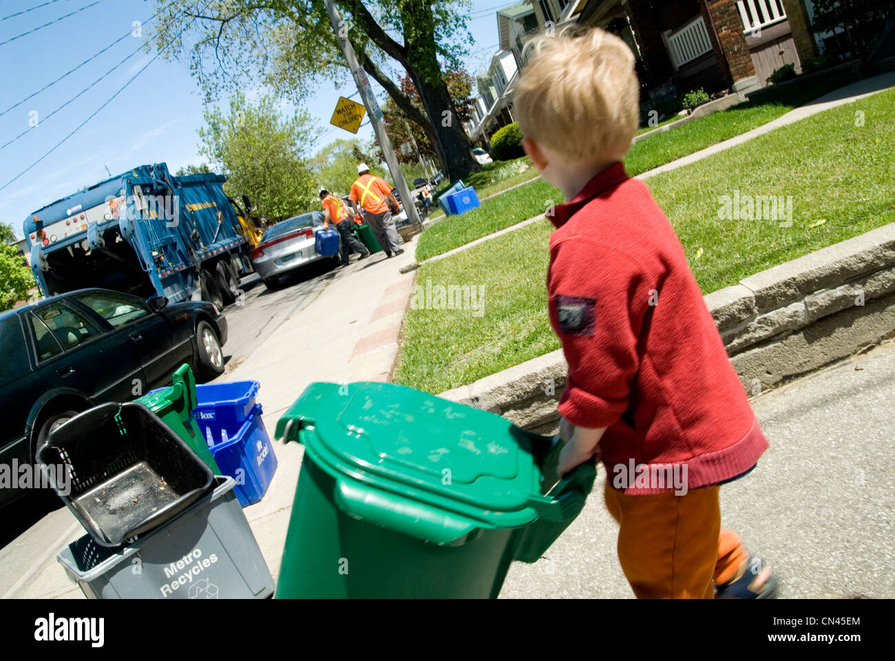 Little Boy Helping to take out the Recycling, Toronto, Ontario Stock ...