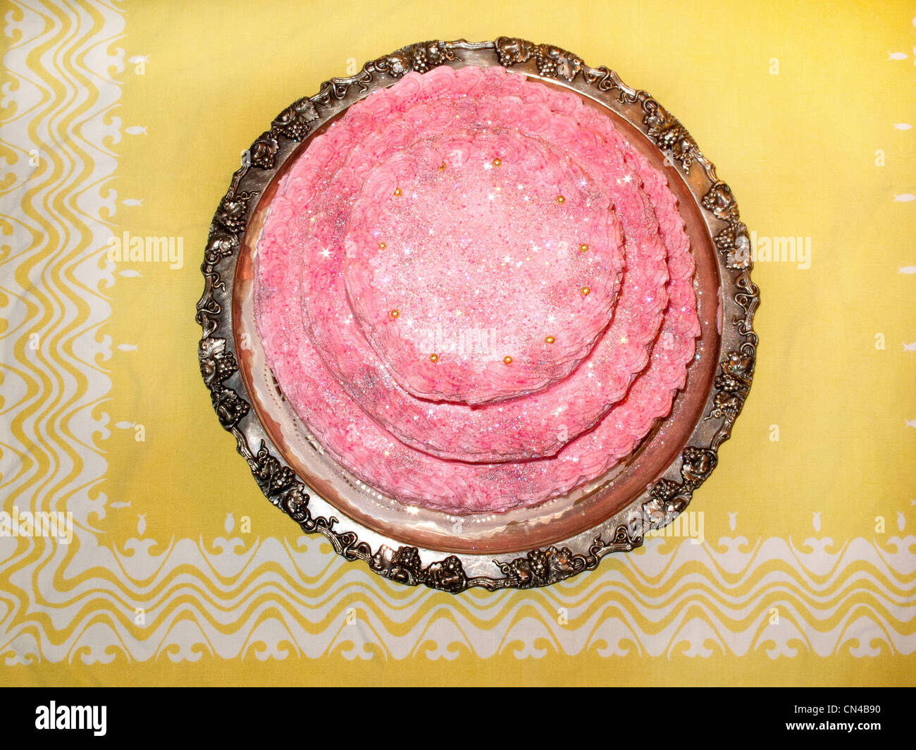 Pink birthday cake on silver tray Stock Photo