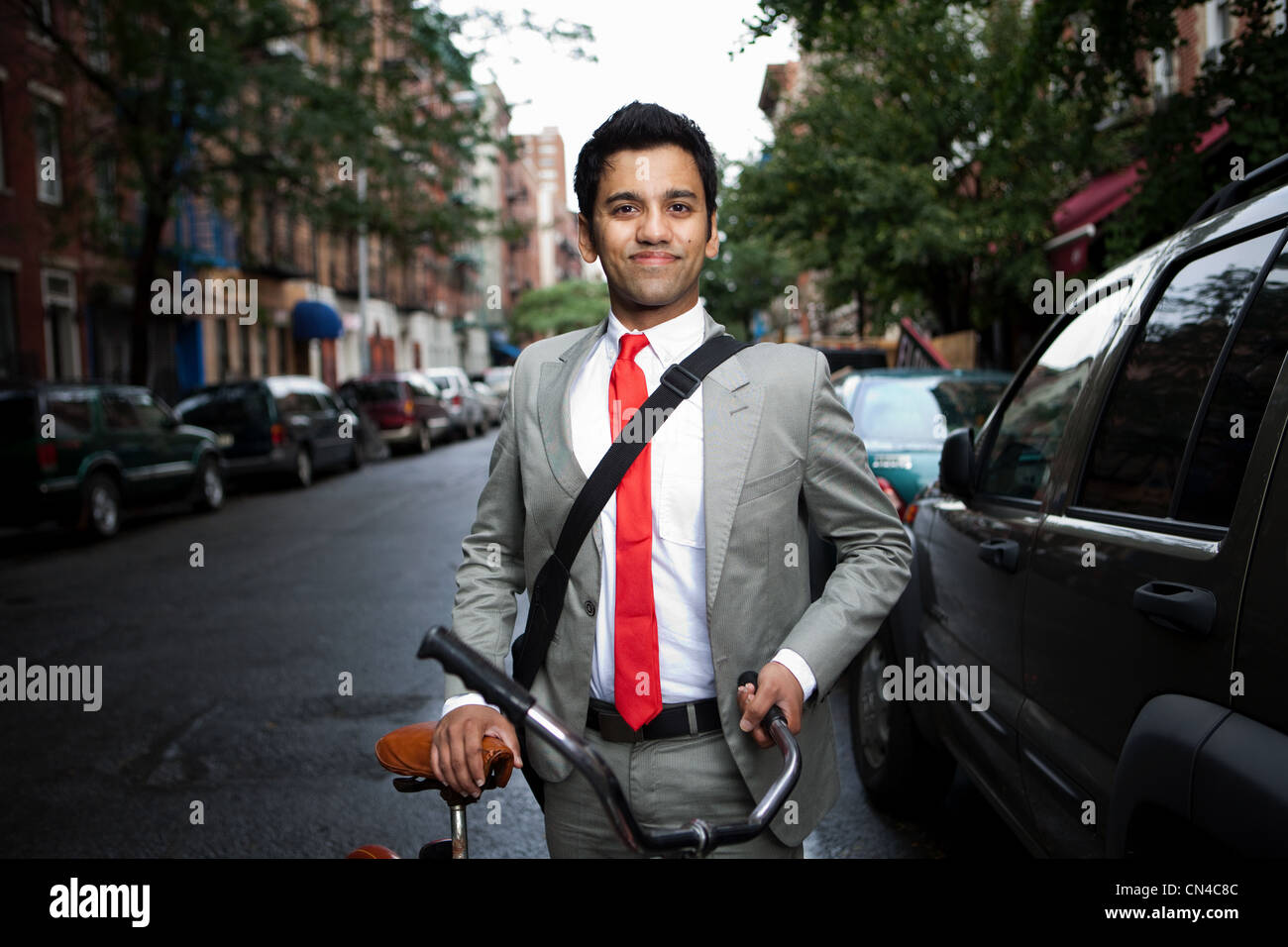 Businessman with bicycle Stock Photo