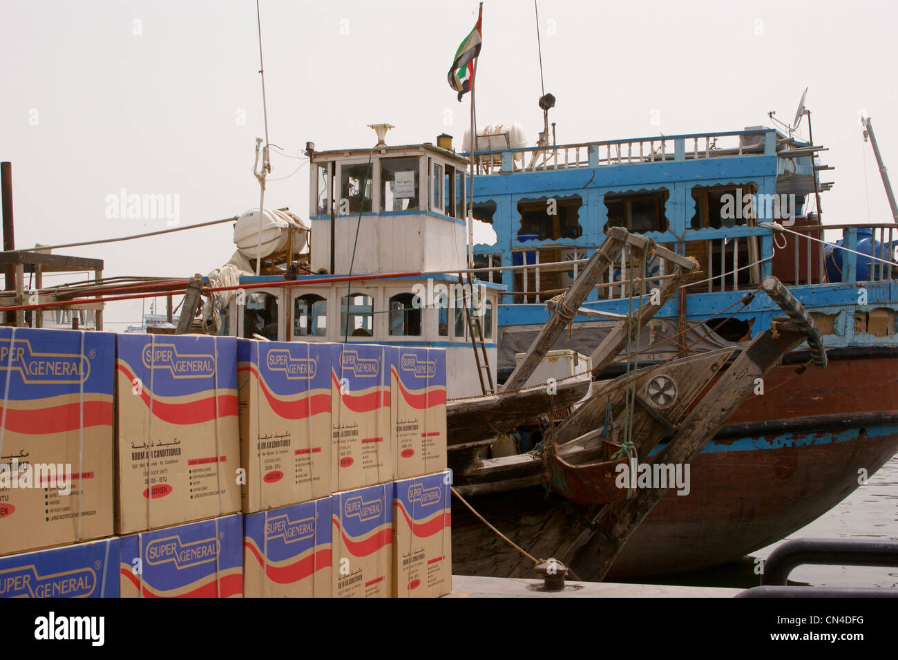 Dhows on the waterfront at Dubai Creek, with air conditioner units