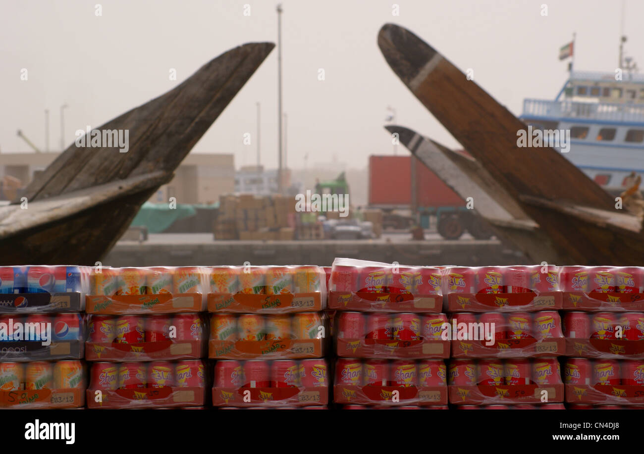 Trays of soft drinks awaiting loading onto dhows, on the waterfront at Dubai Creek,United Arab