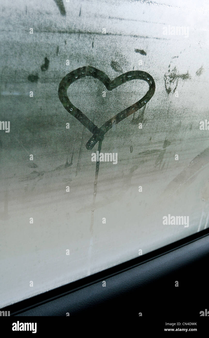Heart shape on car window Stock Photo