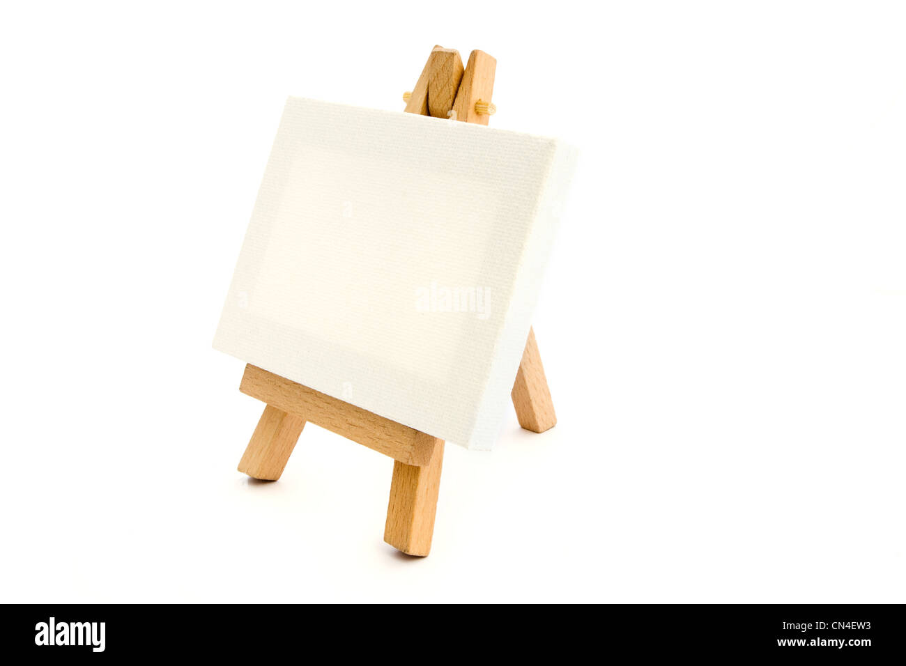 Small easel with a blank canvas over white Stock Photo