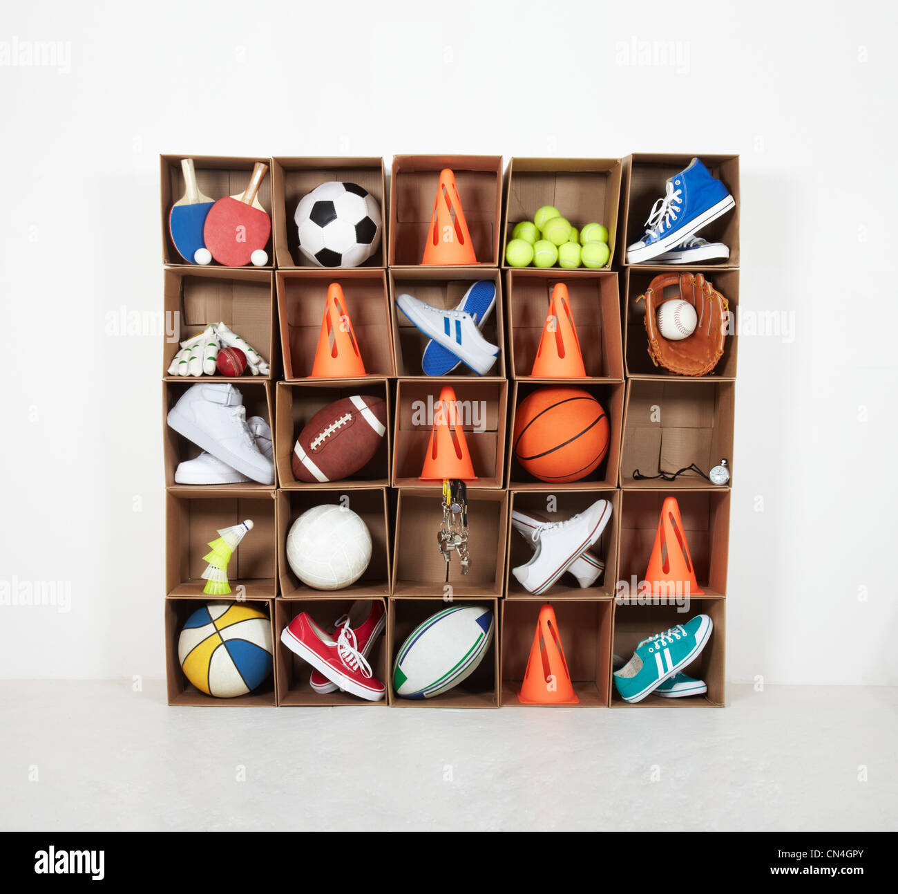 Cardboard box lockers filled with sports equipment Stock Photo