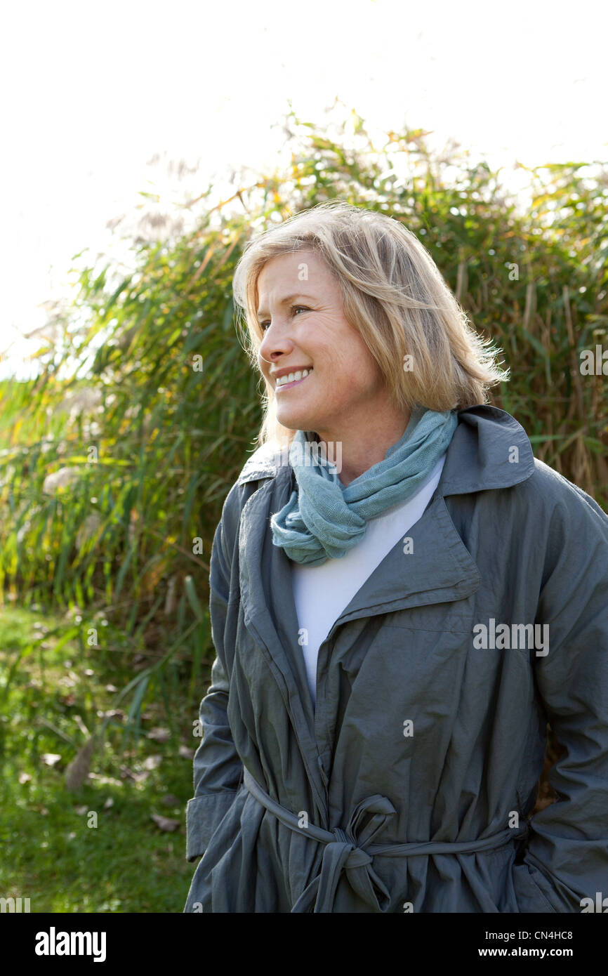 Smiling woman outdoors Stock Photo