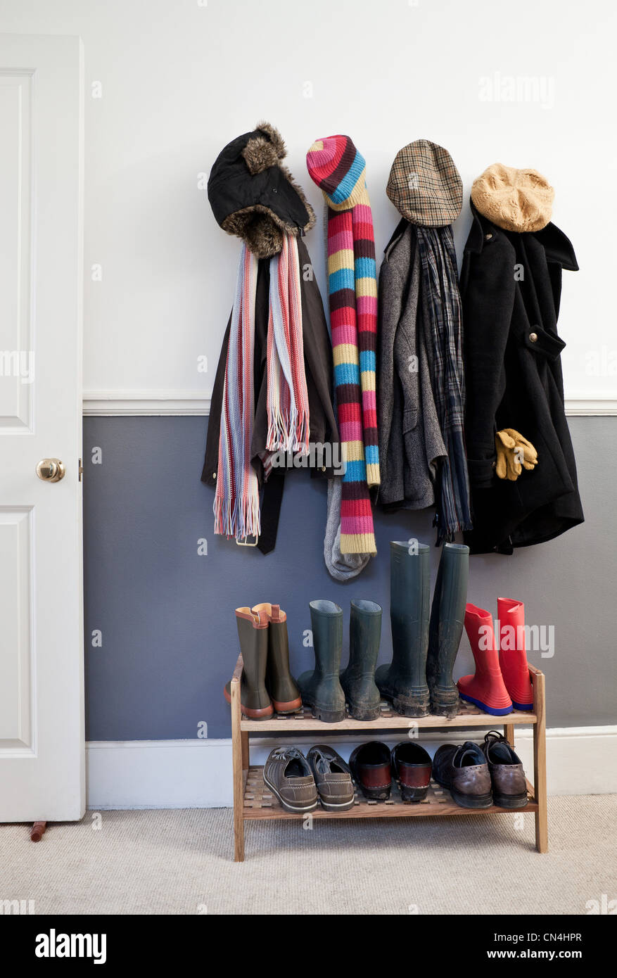 Coats hanging wall hi-res stock photography and images - Alamy