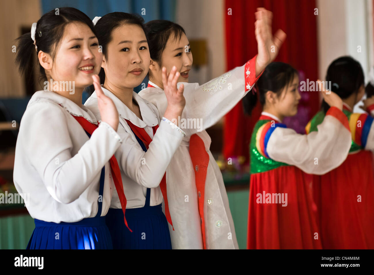North Korea, Pyongyang, students waving goodbye to their foreign guest after a music performance in a model school Stock Photo