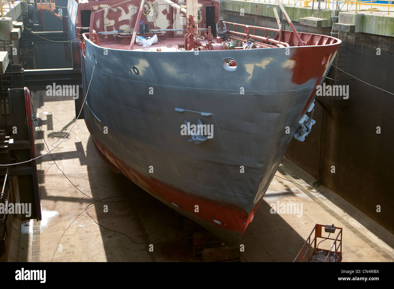 Fishing trawler in shipyard drydock facilities for repairs, maintenance and painting. Fraserburgh ship repair yards. Scotland Uk Stock Photo