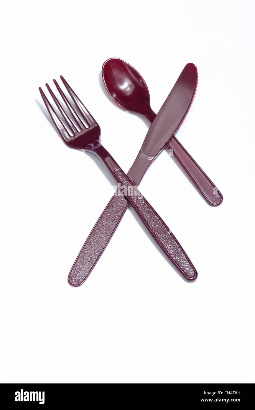 A plastic knife, fork and spoon Stock Photo