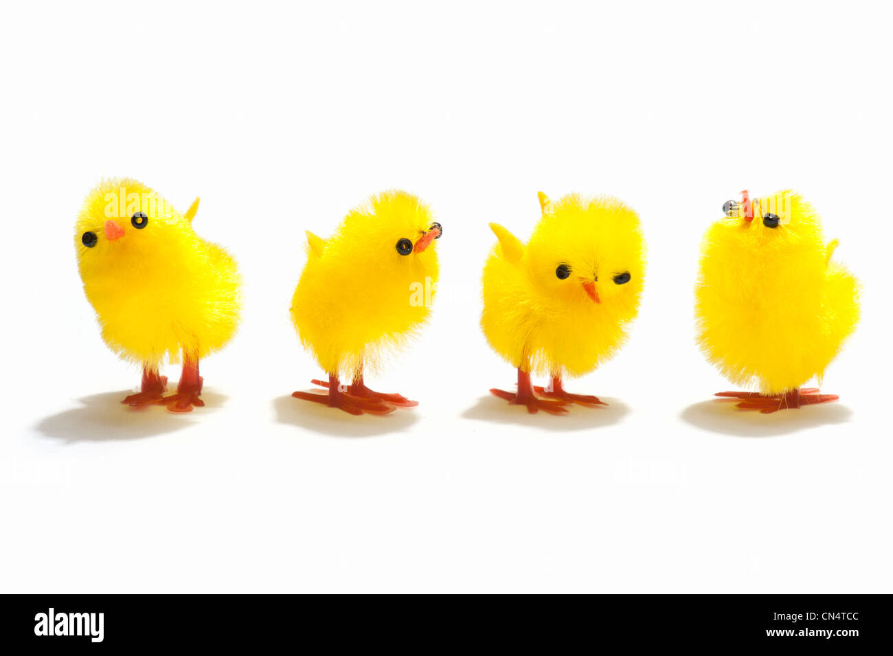Four Easter chick decorations in a row Stock Photo - Alamy