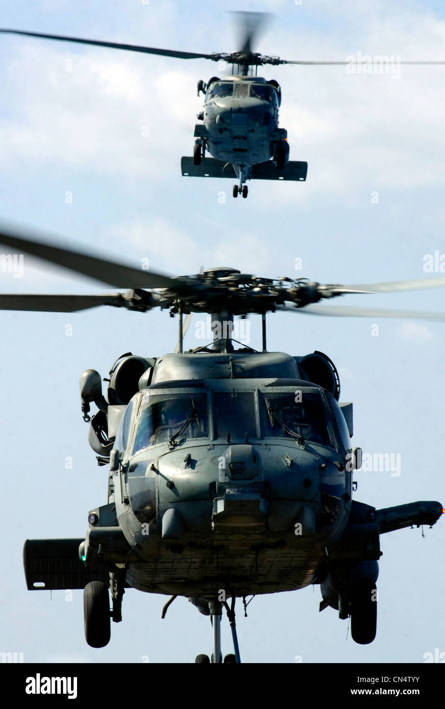 - In the skies above USS Ronald Reagan an HH-60H Seahawk and an SH-60F Seahawk both assigned to the ÒBlack KnightsÓ of Helicopter Anti-Submarine Squadron (HS) 4 move into position to transfer ordnance between the Nimitz-class nuclear powered aircraft carr Stock Photo