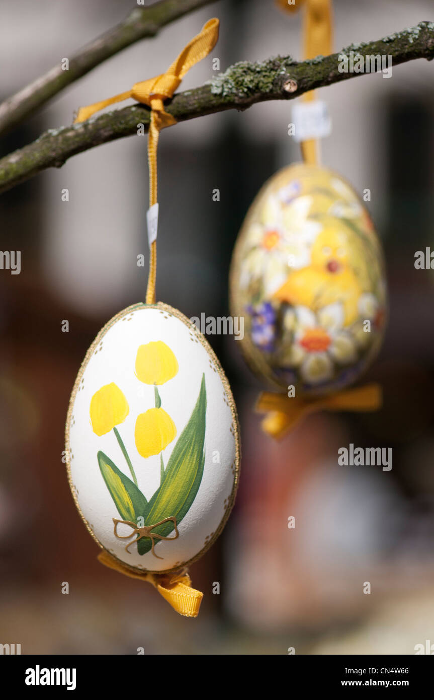 Hand-painted egg shells hanging from a branch to celebrate Easter at the Old Vienna Easter Market at the Freyung, Vienna. Stock Photo