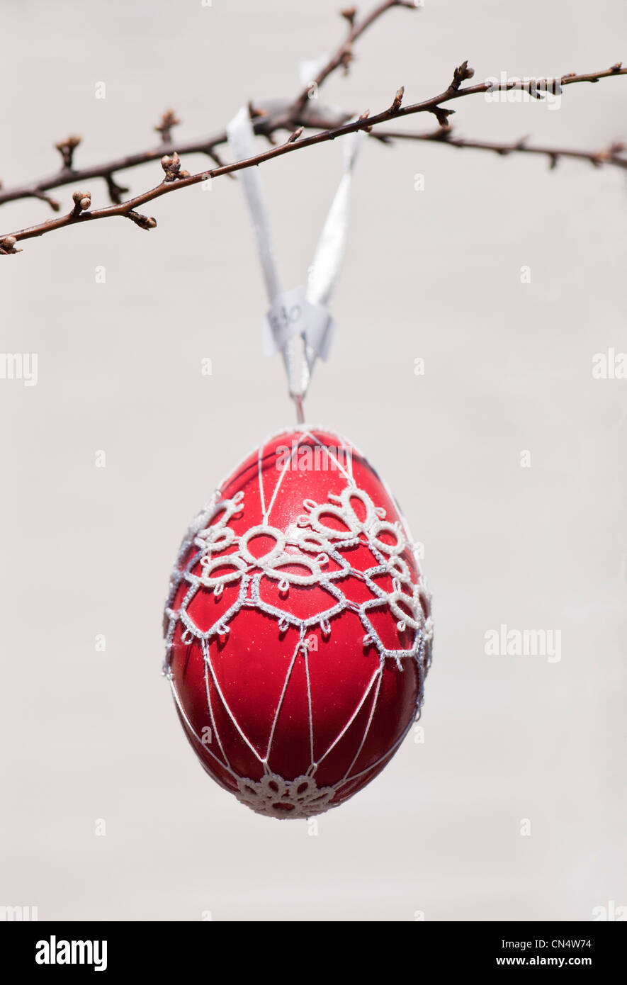 Hand-painted egg shell hanging from a branch to celebrate Easter at the Old Vienna Easter Market at the Freyung, Vienna. Stock Photo