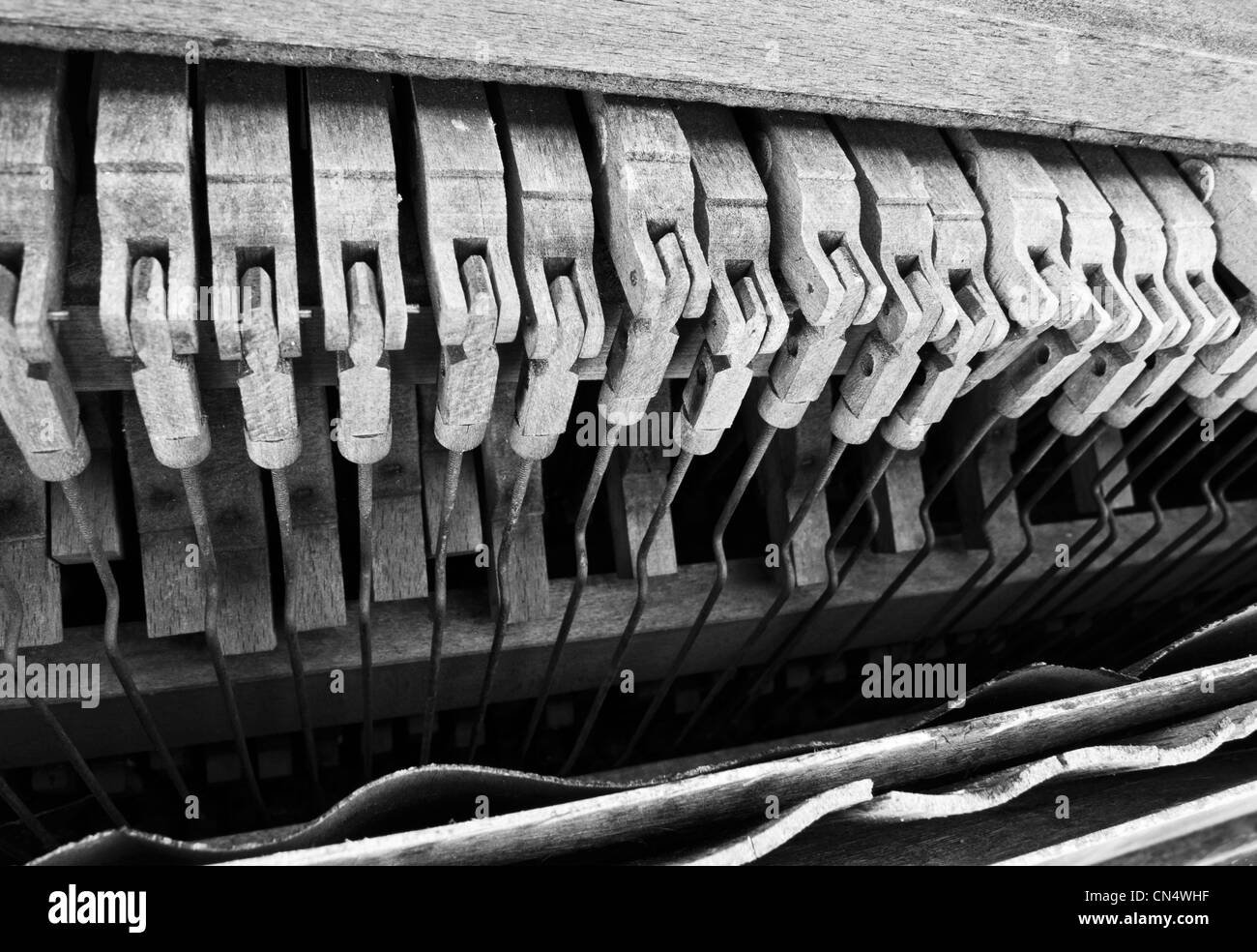 Hammers inside very dilapidated, broken down upright piano. Stock Photo