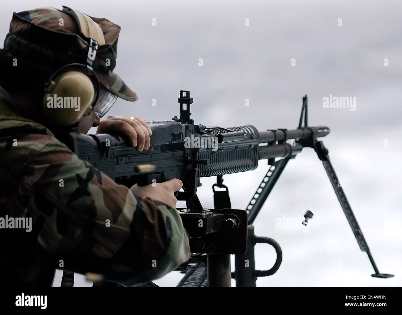 Soldier firing a M-60 machine gun Stock Photo