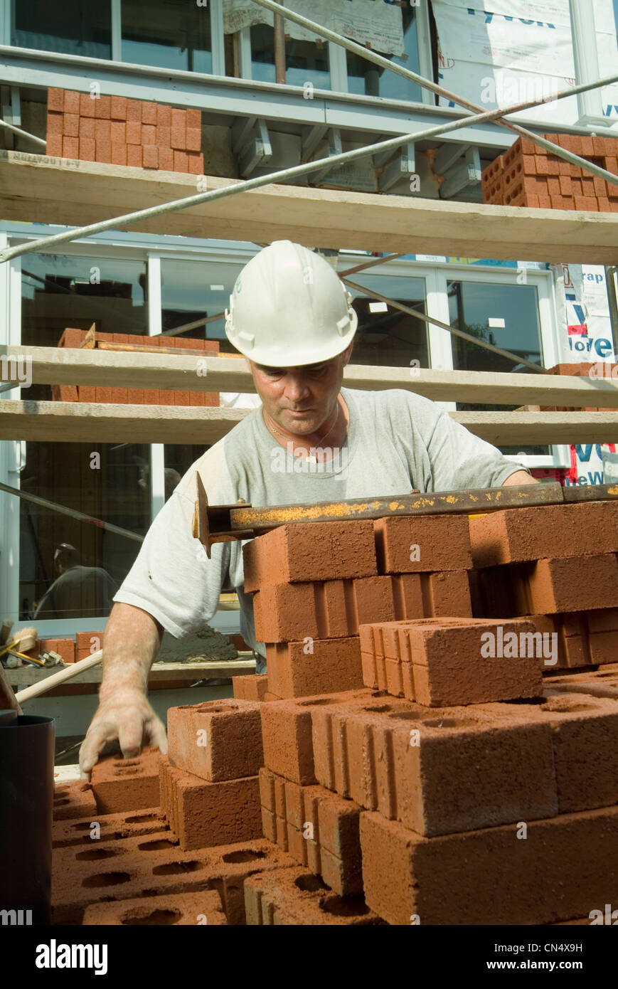Construction Worker Stacking Bricks, Montreal, Quebec Stock Photo Alamy