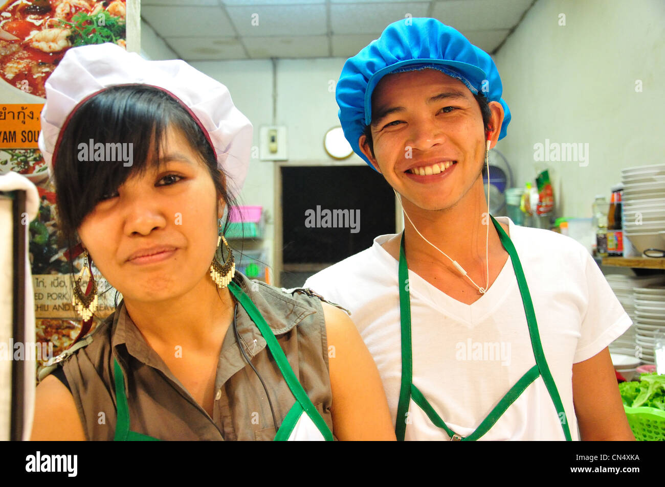 Anusarn Market food stall owners in Chiang Mai Night Bazaar, Chan Klan Road, Chiang Mai, Chiang Mai Province, Thailand Stock Photo