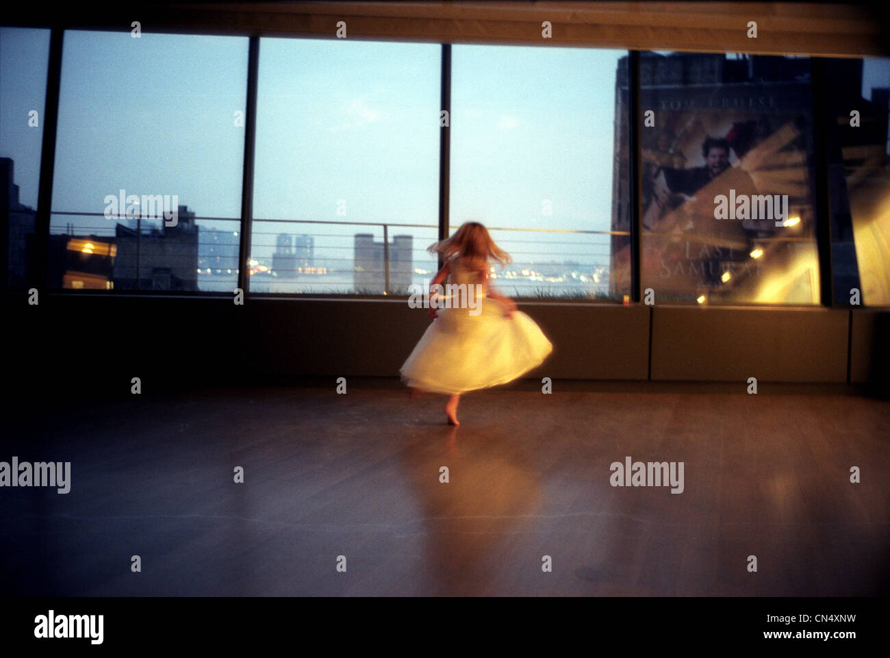 young girl dancing in New York Loft appartment Stock Photo