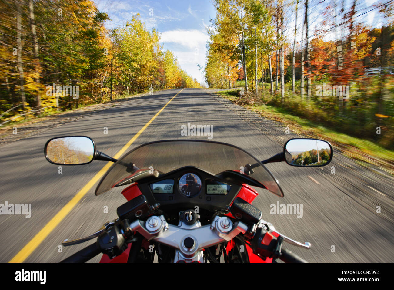 View of a Motorcycle in Action in an Autumn Landscape, Bromont, Quebec Stock Photo