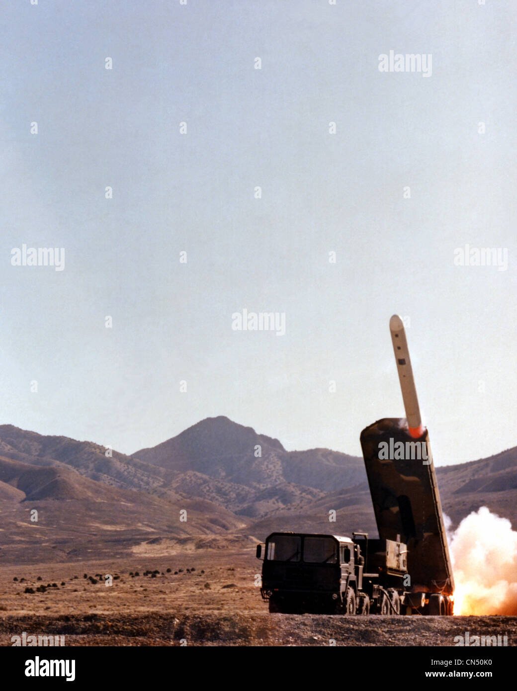 A Ground-Launched Cruise Missile (GLCM) emerges from the Transporter-Erector Launcher (TEL) during a test firing. Stock Photo