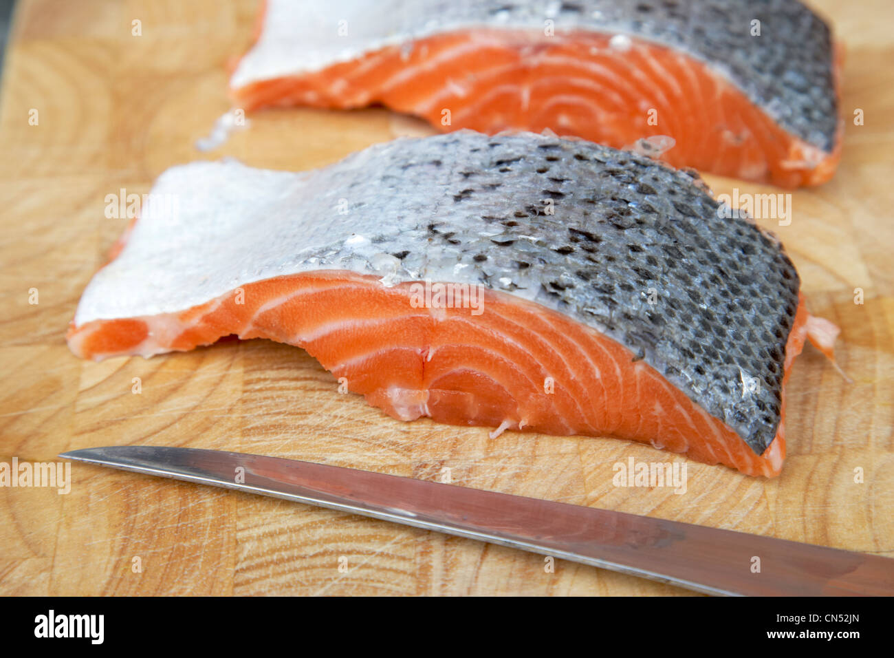 fresh salmon fillet cut into steaks and portions Stock Photo