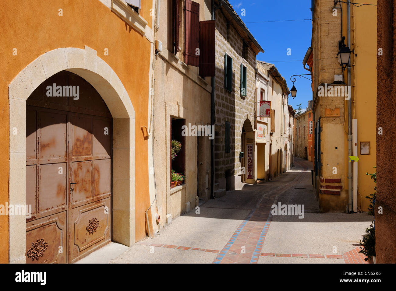 France, Gard, Pays d'Uzege, Saint Quentin la Poterie, the Grand'Rue (main street), the water drainage are also tiled Stock Photo