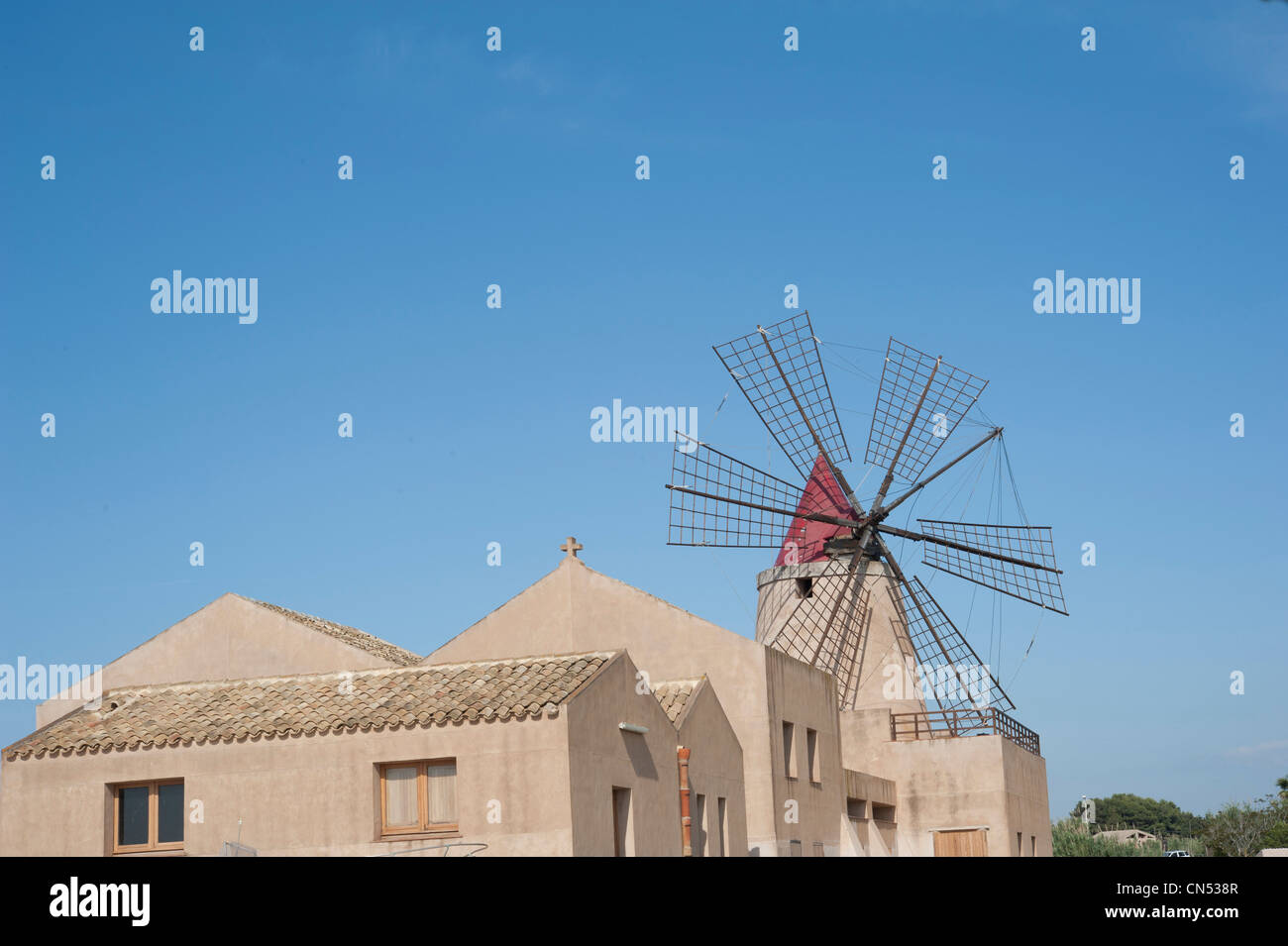 Traditional windmill used for grinding evaporated sea salt, Mozia, Trapani Province, Sicily, Italy Stock Photo