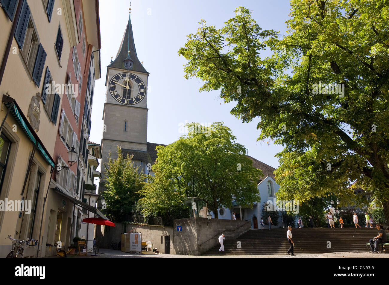 Horizontal wide angle of St Peter kirche, St Peter's church on Lindenhof hill in Zurich on a sunny day. Stock Photo