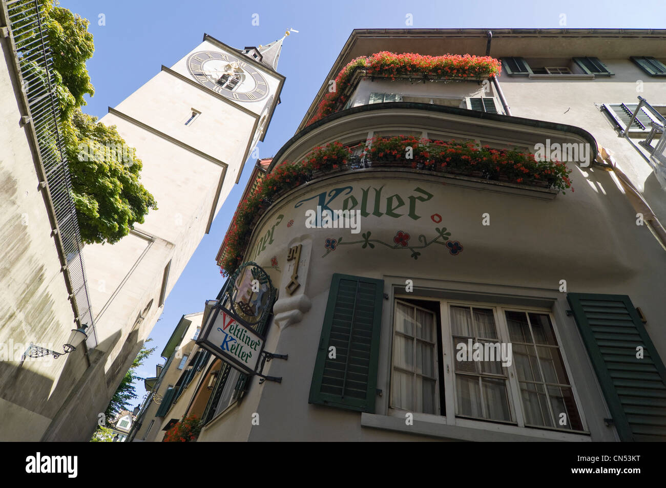 Horizontal wide angle of St Peter kirche, St Peter's church on Lindenhof hill in Zurich on a sunny day. Stock Photo