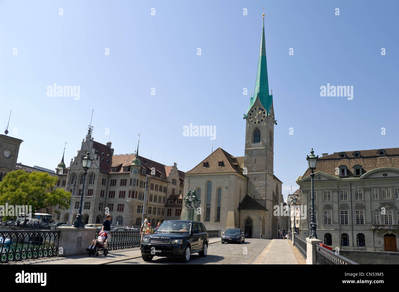 Horizontal wide angle of Fraumünster kirche or abbey with it's prominent spire in central Zurich on a sunny day. Stock Photo