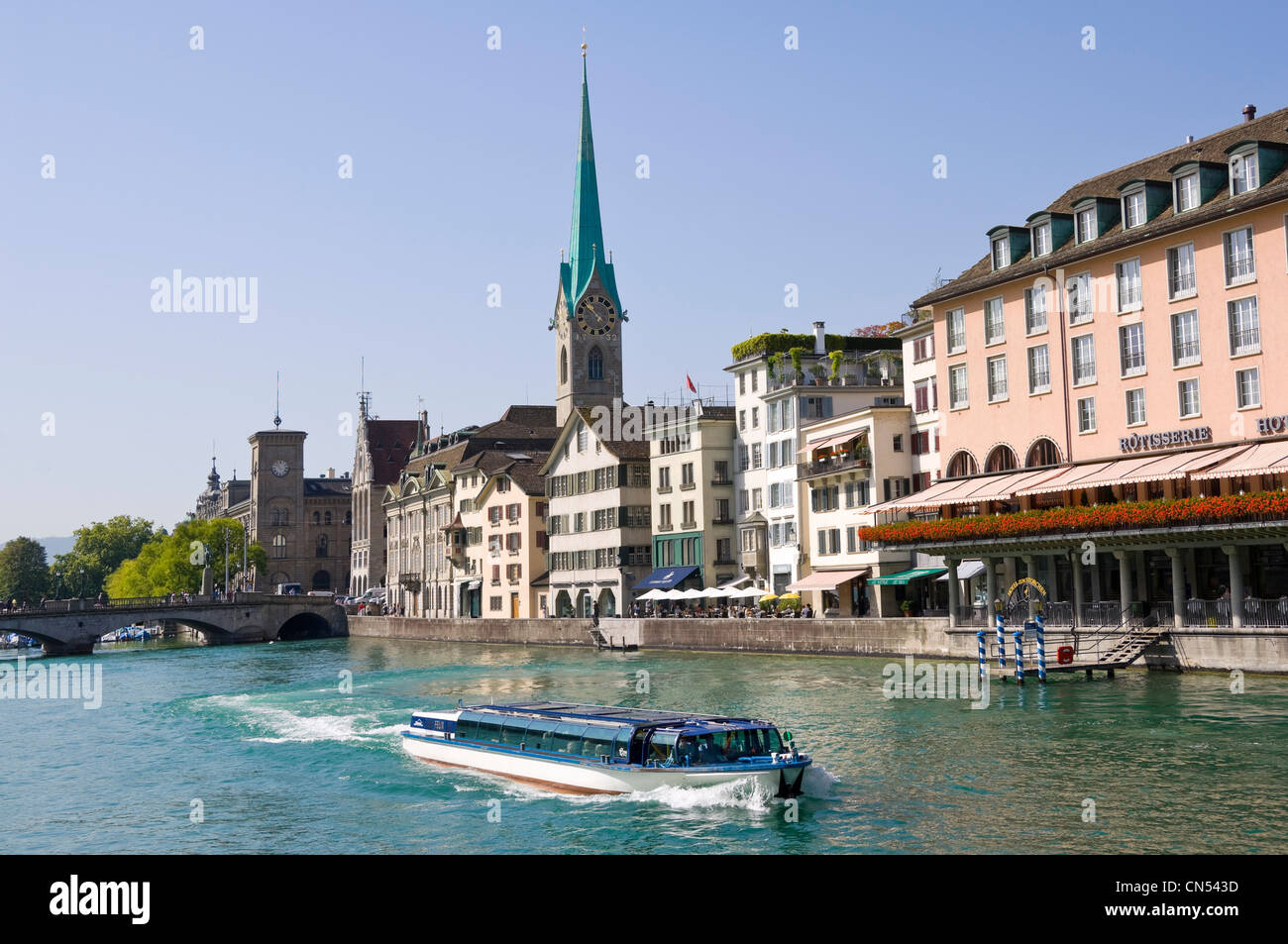 Horizontal wide angle of Fraumünster kirche or abbey with it's prominent spire in central Zurich on a sunny day. Stock Photo
