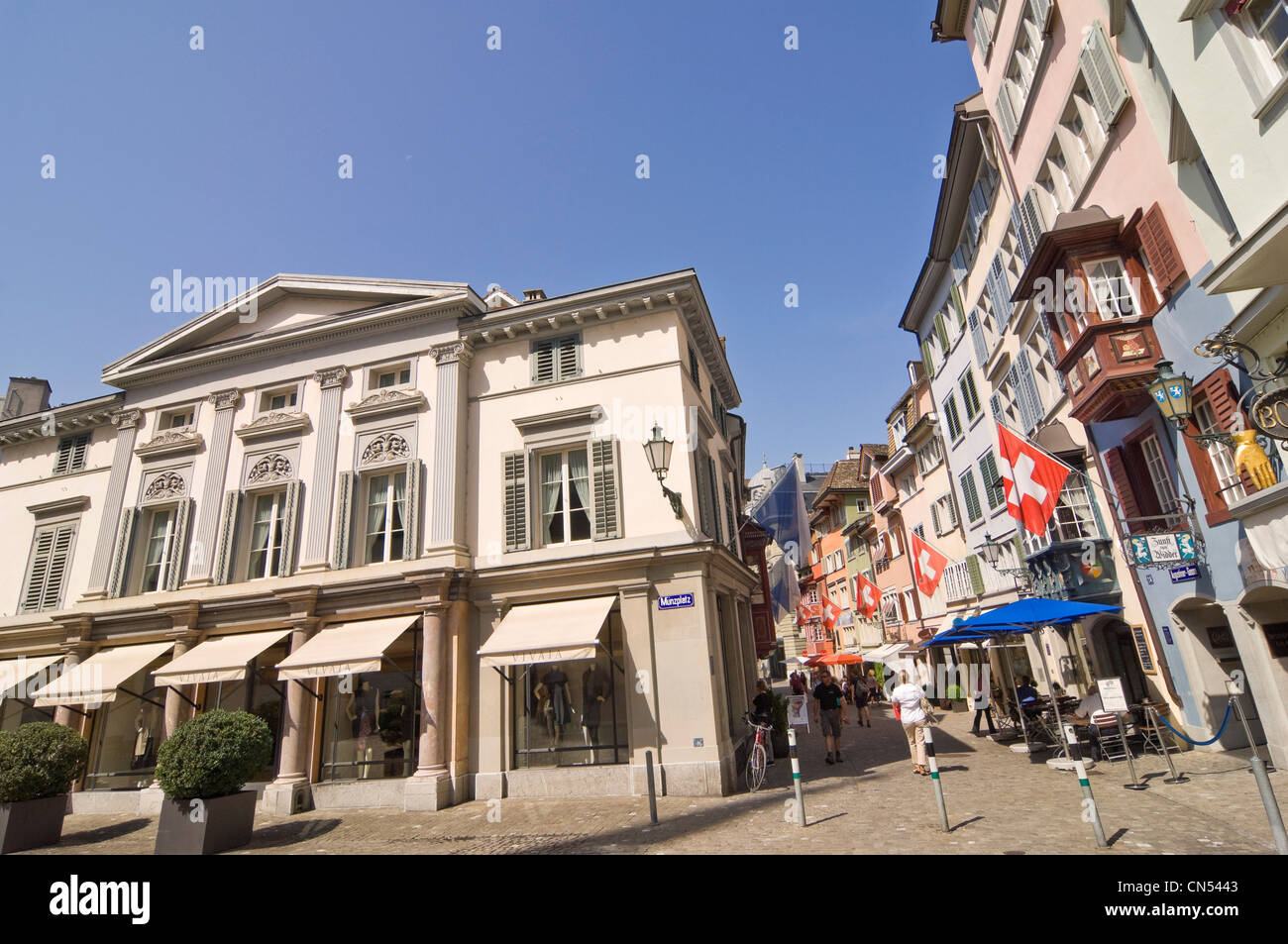 Horizontal wide angle cityscape of Augustinergasse, a popular pedestrianised street in Lindenhof in Zurich on a sunny day. Stock Photo