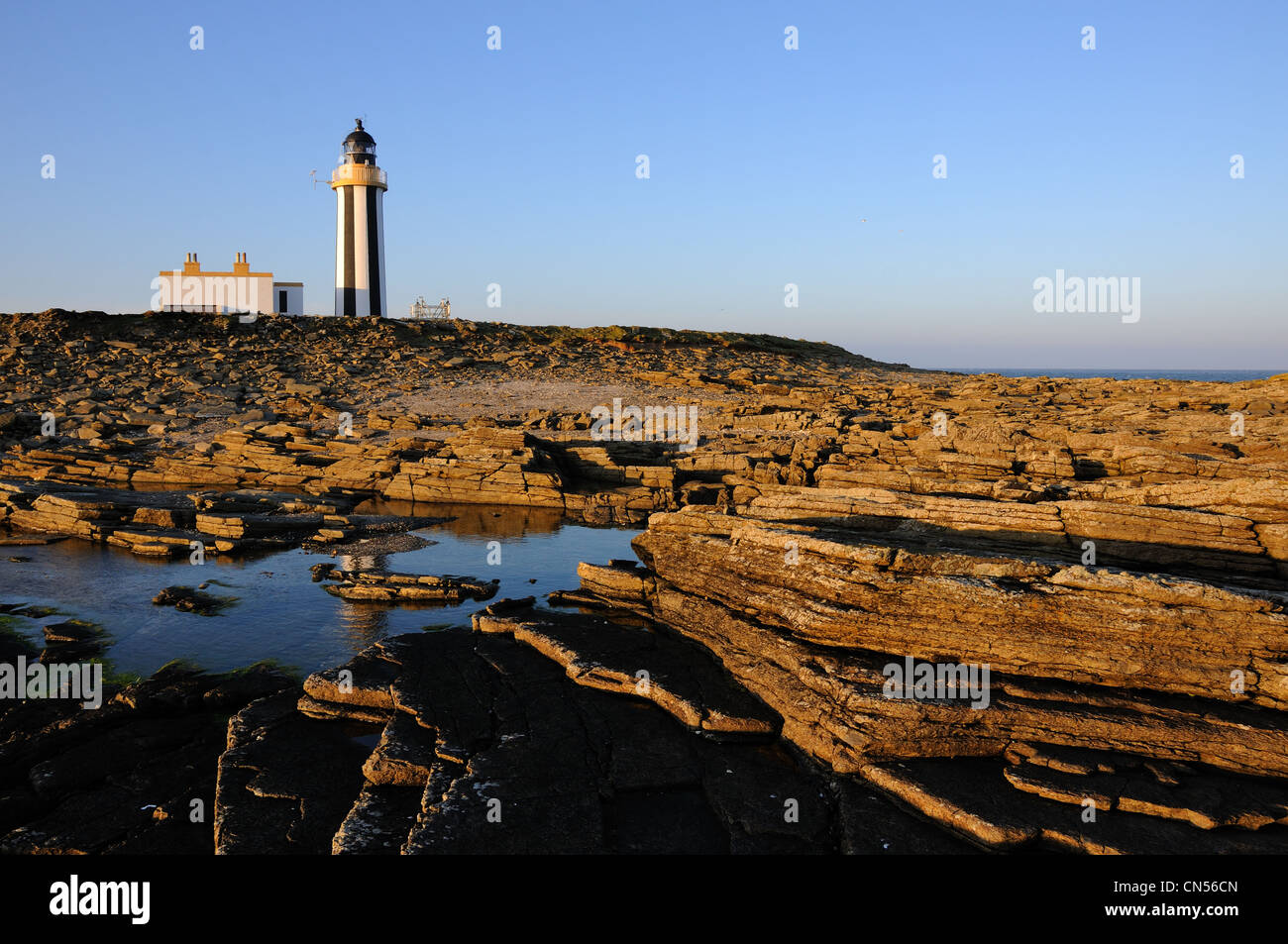 Start Point Lighthouse at sunset, Sanday, Orkney Stock Photo
