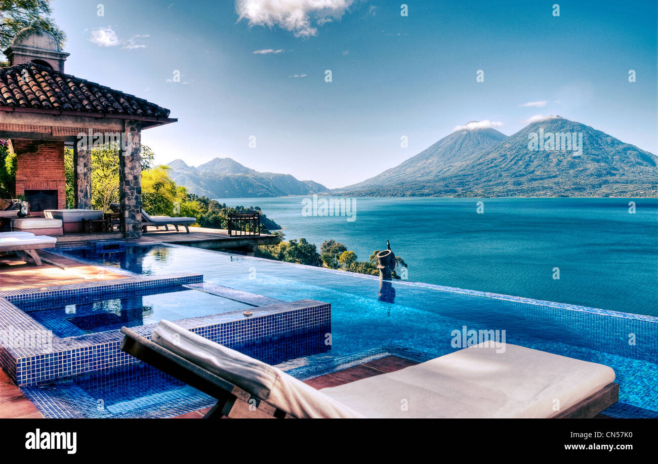 View of Lake Atitlan and Atitlan and Toliman volcanoes from the villa's pool at Casa Palopo. Stock Photo