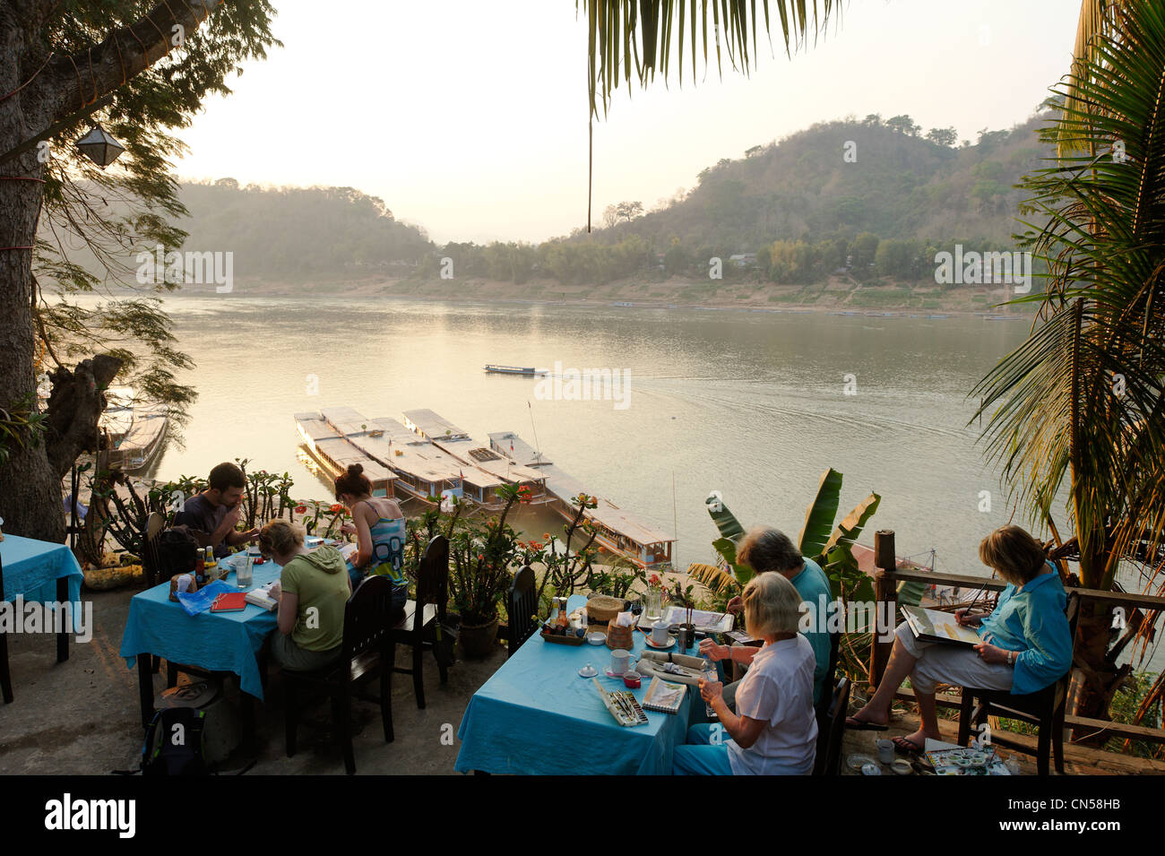 Laos, Luang Prabang Province, Luang Prabang City, restaurant with view on Mekong river, painters of watercolor Stock Photo