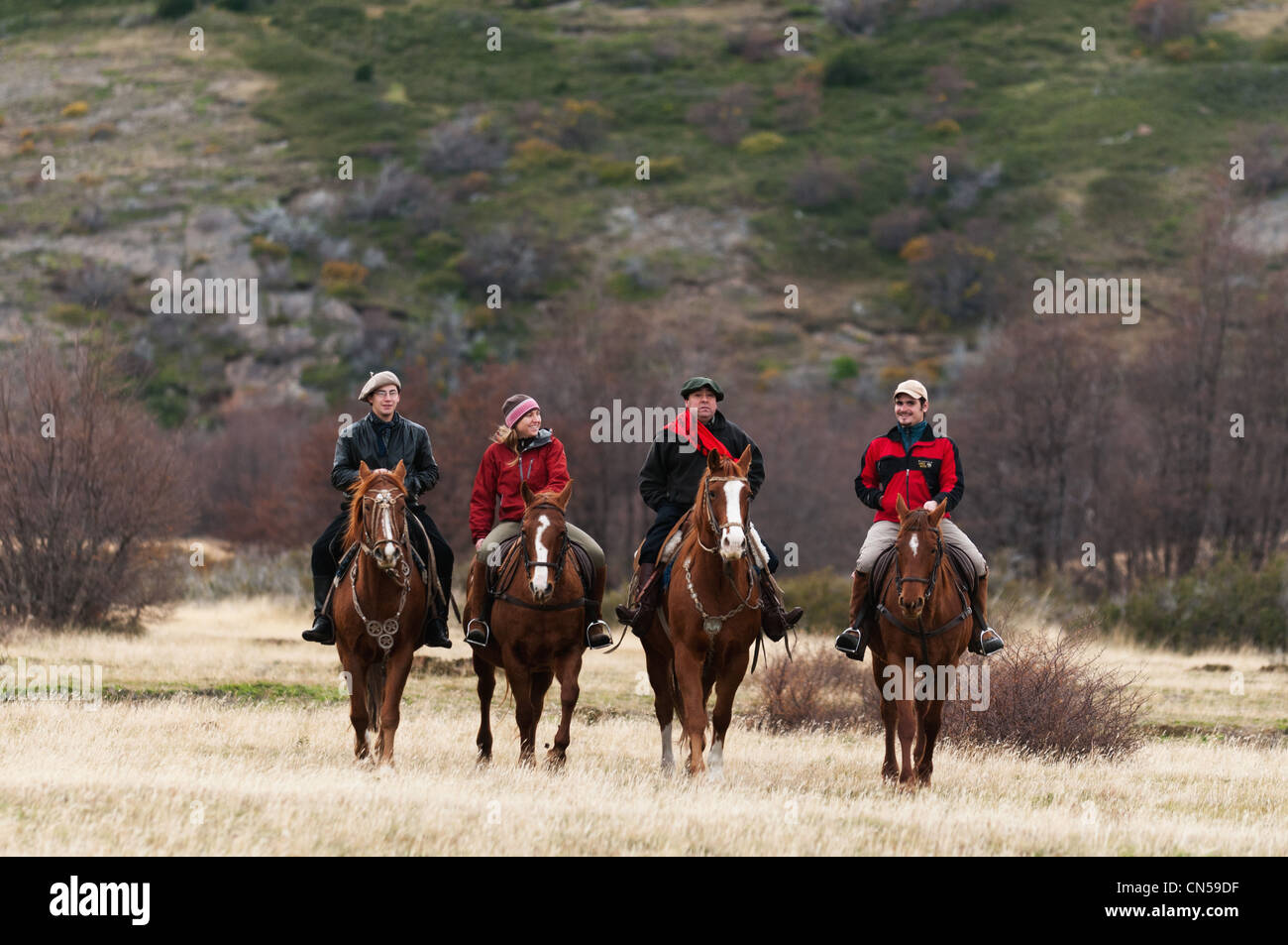 Chile, Patagonia, Magellan Region, Torres del Paine National Park, Gauchos and Tourist on Horse Stock Photo