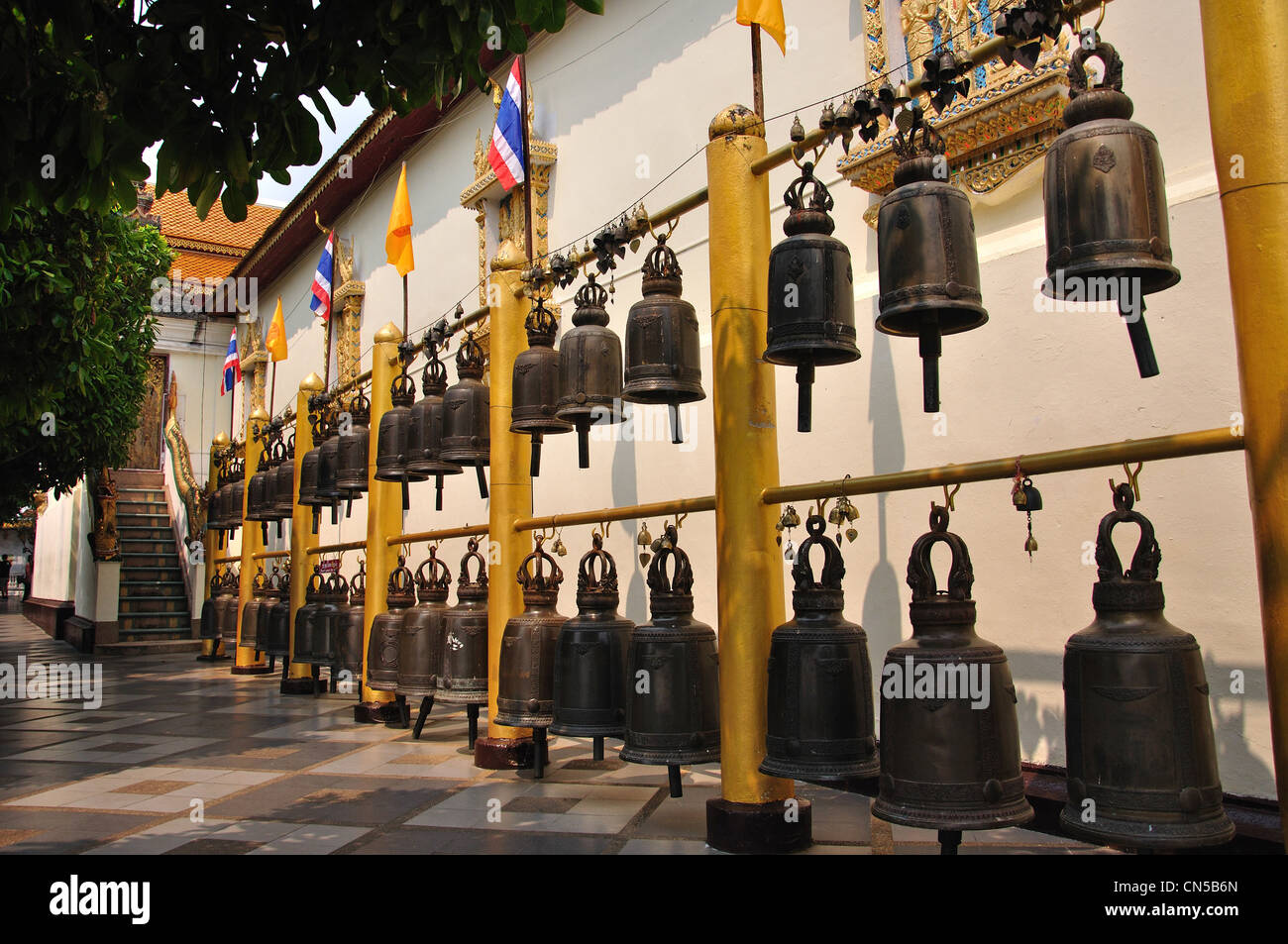 Line of copper gongs at Wat Phrathat Doi Suthep Buddhist temple, Doi Suthep, Chiang Mai, Chiang Mai Province, Thailand Stock Photo