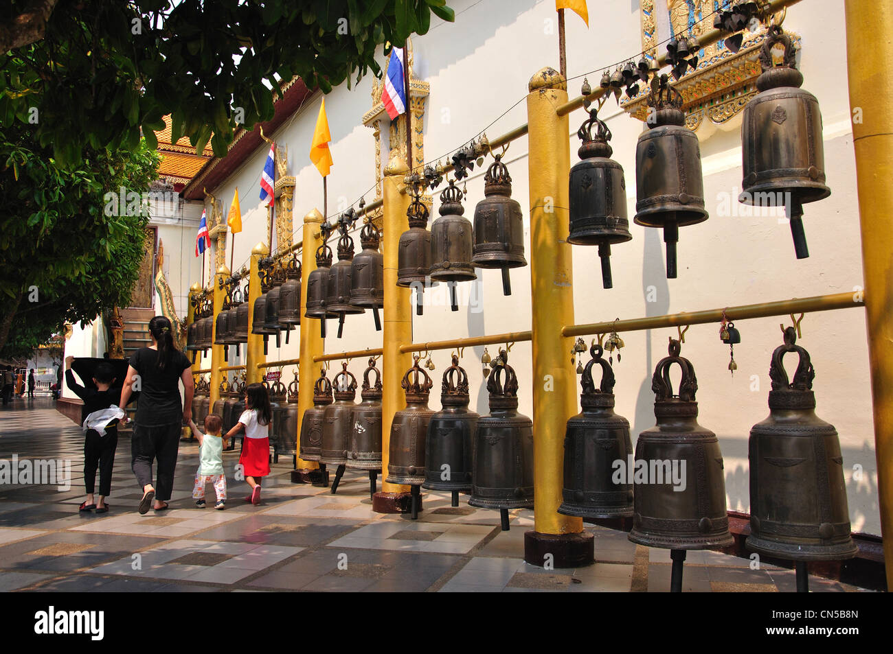 Line of copper gongs at Wat Phrathat Doi Suthep Buddhist temple, Doi Suthep, Chiang Mai, Chiang Mai Province, Thailand Stock Photo