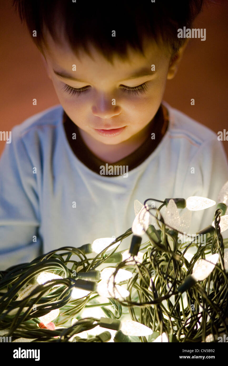 Toddler Holding LED Christmas Lights Stock Photo Alamy