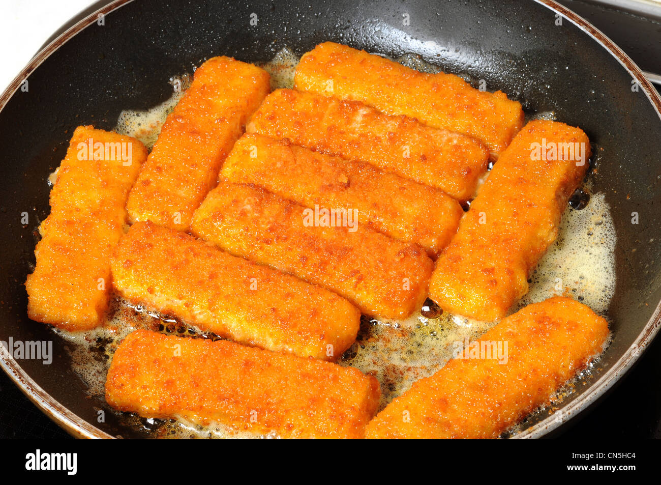 Fish Fingers In A Frying Pan Stock Photo Alamy